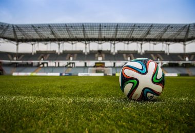 soccer ball on grass field during daytime