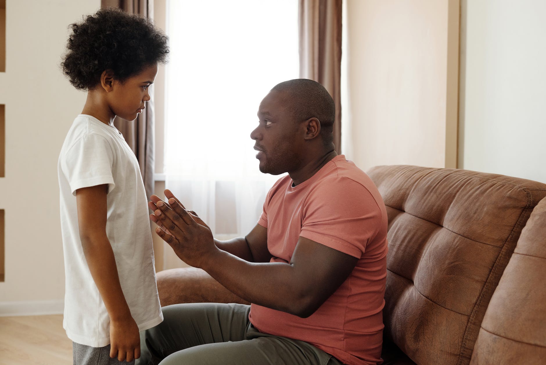 father talking to his son