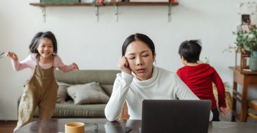 kids making noise and disturbing mom working at home