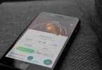 turned on iphone displaying pokemon go charizard application