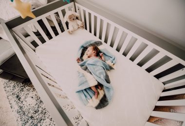 baby in blue blanket