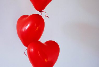 Three red heart balloons