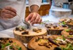 Chef preparing vegetable dish on tree slab
