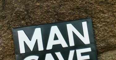 Man cave sign on rock