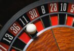Close up of a ball landing on number 11 black in roulette