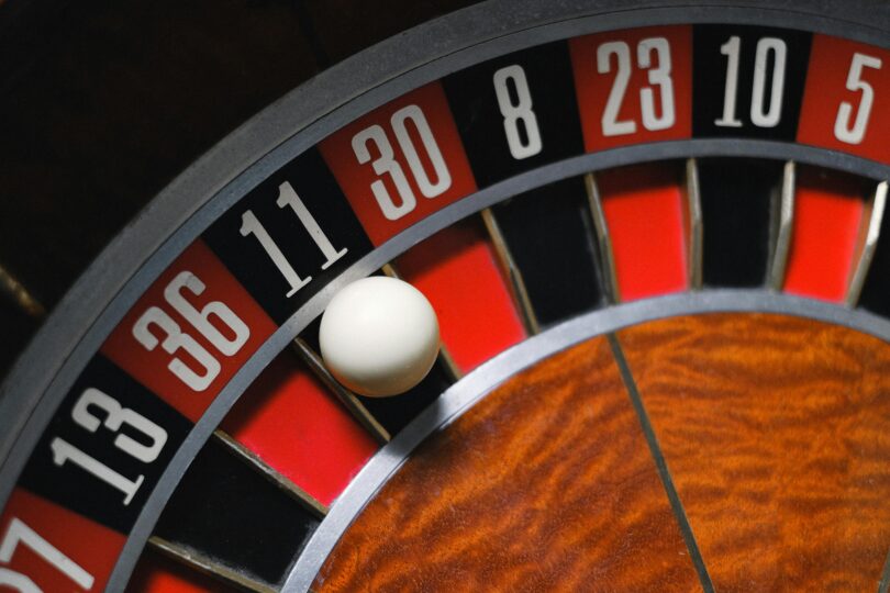 Close up of a ball landing on number 11 black in roulette