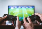 Hands holding the game controllers
