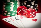 Poker hand with dice and chips in casino setting