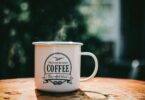 White coffee mug on brown surface