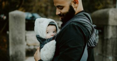 Dad wearing his baby in a carrier