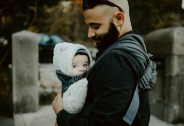 Dad wearing his baby in a carrier