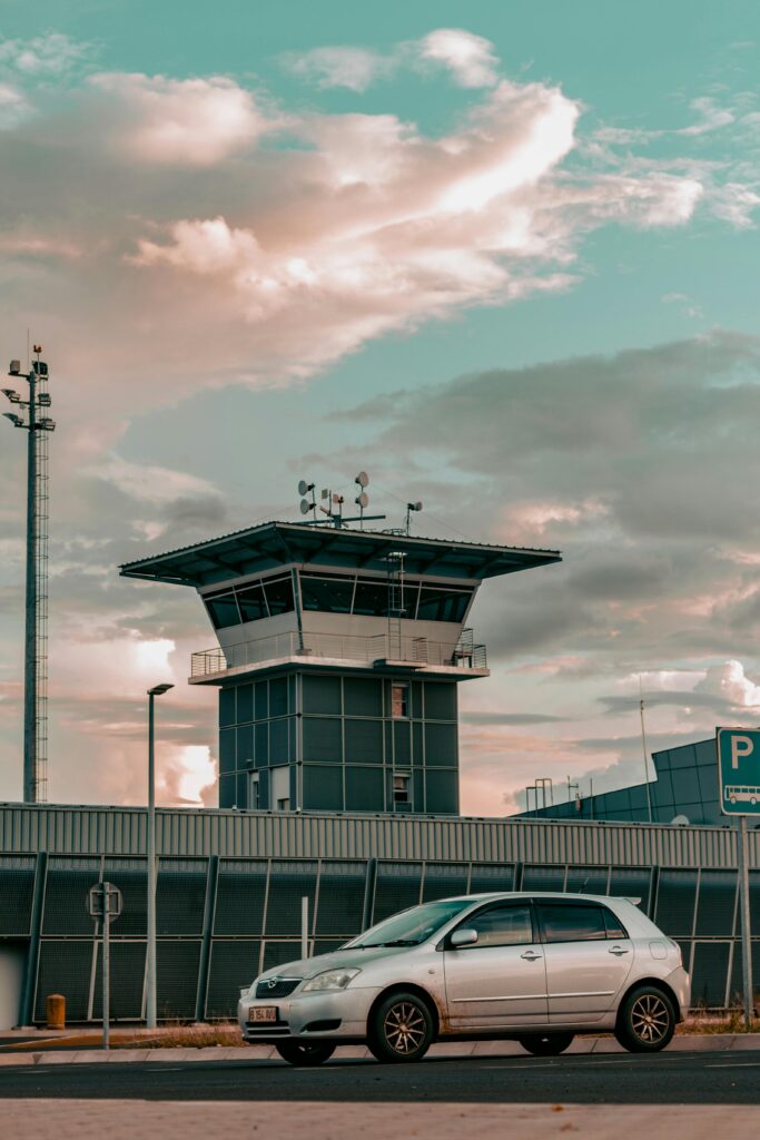 A car near the airport tower